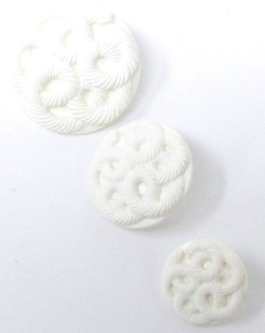 Matte white textured buttons