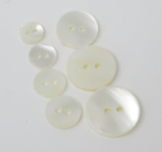 Mother of pearl flat, rimless, 2-hole butttons in several sizes