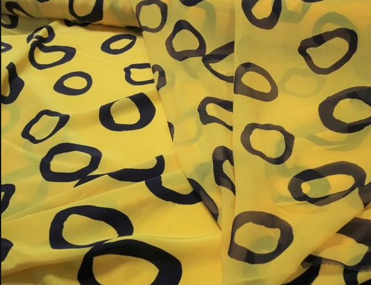 Yellow/navy donut print in coordinating silk crepe de chine and chiffon $29/yd