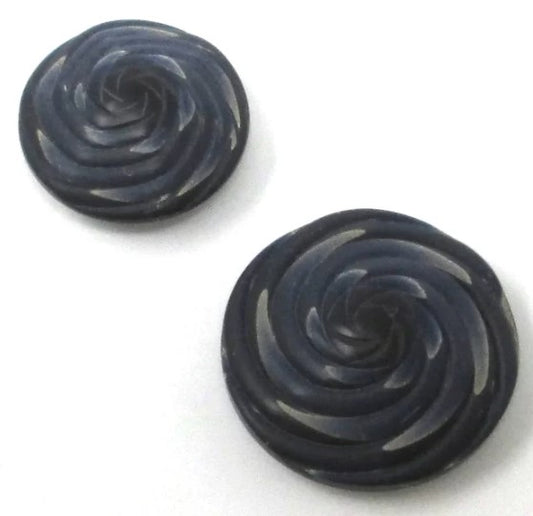 Shade of navy blue matte textured buttons