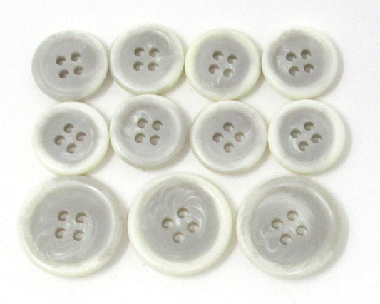 Light gray /white "Trihorn" composite jacket buttons