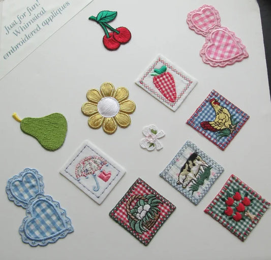 Small embroidered applique grouping, A